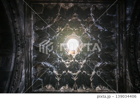 Ancient stone ceiling with radial pattern and central skylight Ancient stone ceiling with radial pattern and central skylight 139034406