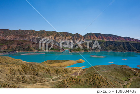 Serene mountain lake with vivid blue water Serene mountain lake with vivid blue water 139034438