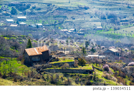 House damaged by landslide on unstable hillside, rural landscape House damaged by landslide on unstable hillside, rural landscape 139034511