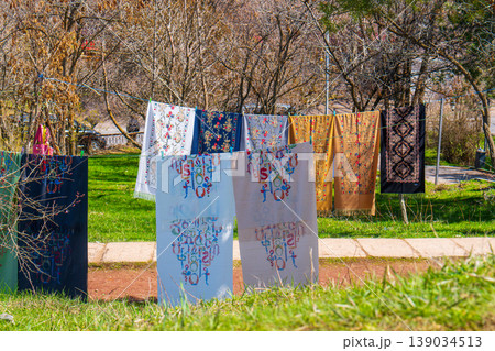 Outdoor clothesline with assorted fabrics on sunny day 139034513