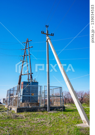 Utility infrastructure in rural landscape under sunny skies Utility infrastructure in rural landscape under sunny skies 139034583