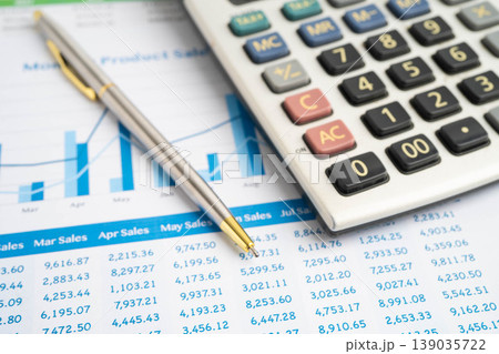 Calculator with pen on data business graphs paper. Calculator with pen on data business graphs paper. 139035722