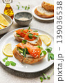 Salmon bruschetta with cream cheese and avocado slices 139036538