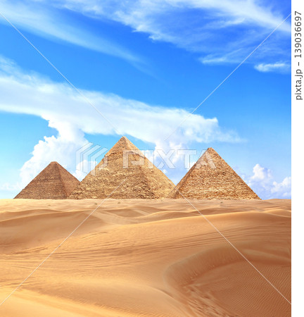 Famous Great Pyramids of Menkaure, Chephren and Cheops, Cairo, Egypt. Three iconic Great Pyramids and beautiful sand dunes, Giza Necropolis, have become a popular destination for travellers 139036697