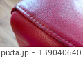 Red Leather Texture Close Up with Stitching 139040640
