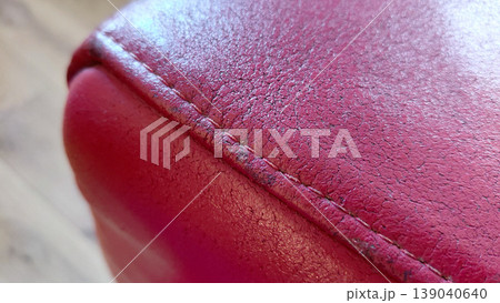 Red Leather Texture Close Up with Stitching 139040640