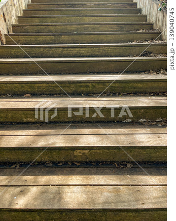 Wooden stairs texture with natural wear, outdoor background 139040745