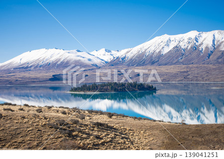 Motuariki island with alpine mountain reflection Motuariki island with alpine mountain reflection 139041251