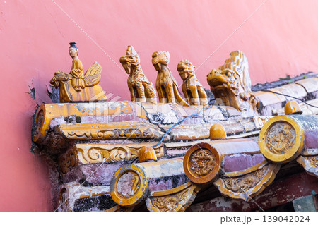Close-up on mysterious animals on the palace roofs of the Forbidden City in Beijing that symbolizes rank and position 139042024