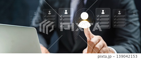Human resources manager selecting the best candidate from a digital interface of resumes. Concept of recruitment, talent acquisition, and digital job search Human resources manager selecting the best candidate from a digital interface of resumes. Concept of recruitment, talent acquisition, and digital job search 139042153