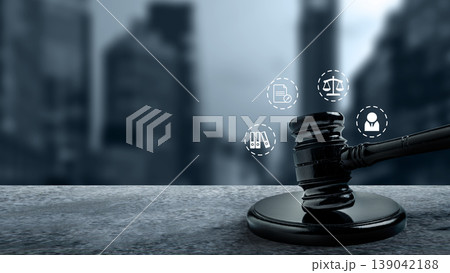 Judge gavel on a stone surface with digital law icons and a blurred city skyline background, representing modern corporate justice and legal advocacy 139042188
