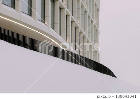 Modern building facade snowing on abstract structure 139043041