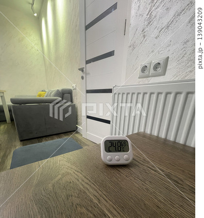 thermometer on the table near the heater 139043209