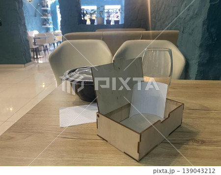 a box of bill on a table in restaurant 139043212