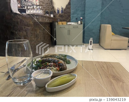 plates of food on a table in restaurant 139043219