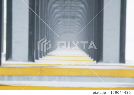 the columns of the bridge stretching into the distance. Beautiful geometry 139044450