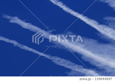 Traces airplane blue sky clouds background abstract lines stripes pattern Traces airplane blue sky clouds background abstract lines stripes pattern 139044697