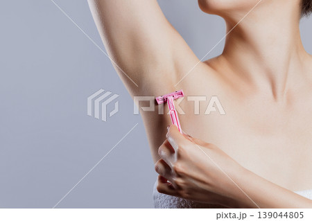 Hands are shaved, armpits or plucking the armpits by using a razor, Depilation and skin care concept. Hands are shaved, armpits or plucking the armpits by using a razor, Depilation and skin care concept. 139044805