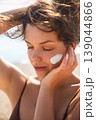 Pretty Woman Touching Face With Sunscreen On Skin At Beach Close Up. Beauty Skincare And Sun Protection Concept 139044866