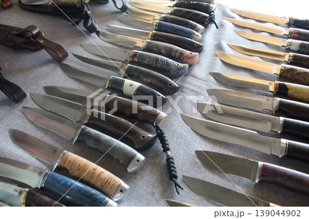 A collection of knives with a short handle. Melee weapons 139044902