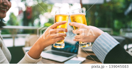 Two young adult asian business women enjoy eating dinner cheers beer together at restaurant Two young adult asian business women enjoy eating dinner cheers beer together at restaurant 139045083