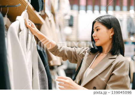 Business woman shopping clothing shop in department store after work life baclance modern lifestyles Business woman shopping clothing shop in department store after work life baclance modern lifestyles 139045096