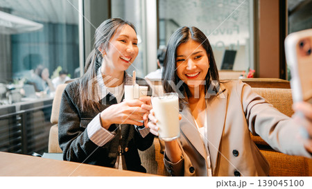 Relax two young adult asian woman talking positive friendship conversation happiness at restaurant 139045100