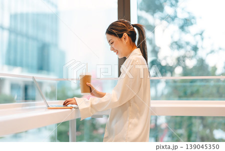 Happy smiling business young asian woman working on laptop freelance modern technology lifestyles Happy smiling business young asian woman working on laptop freelance modern technology lifestyles 139045350