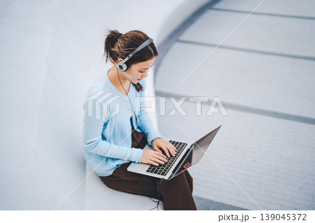 Young adult business asian woman hand typing keyboard looking at laptop freelance modern lifestyles Young adult business asian woman hand typing keyboard looking at laptop freelance modern lifestyles 139045372