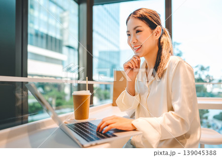 Happy smiling business young asian woman working on laptop freelance modern technology lifestyles Happy smiling business young asian woman working on laptop freelance modern technology lifestyles 139045388