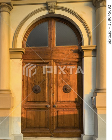 classic italian door with stone arch 139045692