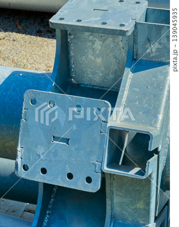 Close up of a metal structure with holes and pipes in a construction area during the day Close up of a metal structure with holes and pipes in a construction area during the day 139045935