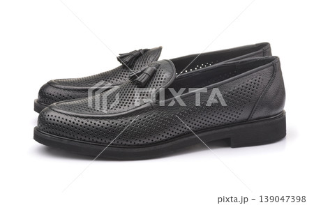 Side view of black leather tassel loafers Side view of black leather tassel loafers 139047398