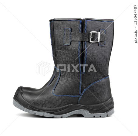Side view of black winter work boots 139047407