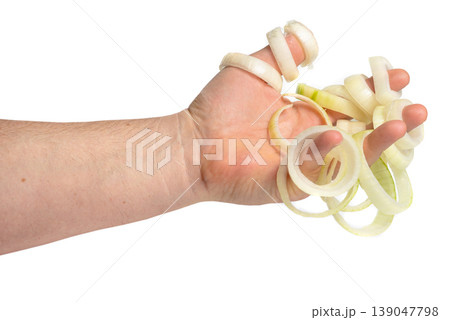 Hand squeezing fresh sliced onion rings Hand squeezing fresh sliced onion rings 139047798