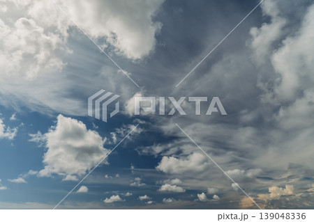 beautiful sky with cumulus clouds, a background for Earth Day and the rebirth of nature in spring ahead of summer, a background idea with copy space for text 139048336