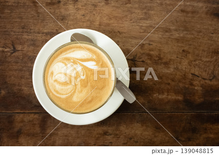 Flat white coffee in cafe on wooden background, top view Flat white coffee in cafe on wooden background, top view 139048815