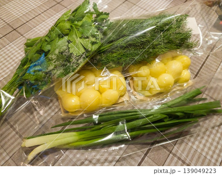 Vacuum packed boiled potatoes and greens ready for a healthy meal preparation 139049223