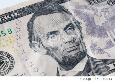 American dollar bills in close-up, showing the image of the president on the banknotes. American dollar bills in close-up, showing the image of the president on the banknotes. 139050033