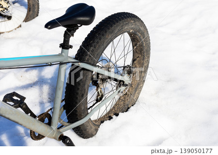 Dirtcovered bike after thawing. Scene shows muddy bike on warm day after snow melt 139050177