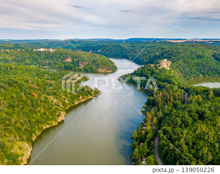 Aerial view of Cornstejn castle near Dyje river. Landscape panoramic view of medieval castle on top of hill with forest around. South Moravia region, Czech republic. Aerial view of Cornstejn castle near Dyje river. Landscape panoramic view of medieval castle on top of hill with forest around. South Moravia region, Czech republic. 139050226