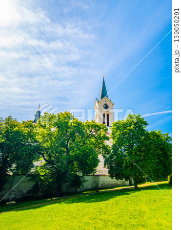 Church of the St. Wenceslaus at Mnisek pod Brdy city, built in gothic style. Church is placed in center of small city near famous chateau. 139050291