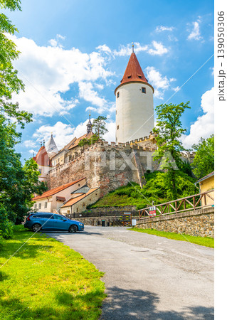 The Krivoklat castle, Czech republic. Famous gothic castle built on big rock. Summer day with blue sky and clouds. Famous tourist destination, medieval architecture. The Krivoklat castle, Czech republic. Famous gothic castle built on big rock. Summer day with blue sky and clouds. Famous tourist destination, medieval architecture. 139050306