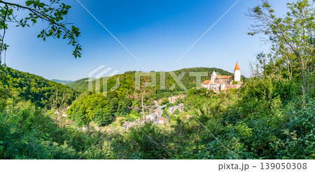 Panorama view of medieval castle Krivoklat, Czech Republic. Sunny day during summer, fresh forest near the castle. Panorama view of medieval castle Krivoklat, Czech Republic. Sunny day during summer, fresh forest near the castle. 139050308