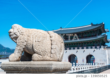 Seoul, South Korea - Apr. 12, 2026 : Haetae Statue and Gwanghwamun Gate under Blue Sky, Seoul, South Korea Seoul, South Korea - Apr. 12, 2026 : Haetae Statue and Gwanghwamun Gate under Blue Sky, Seoul, South Korea 139050525