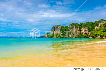 Panoramic view of Railay beach Krabi, Thailand. Beautiful tropical paradise with fresh blue water, hot sand and limestone rock above sea. Famous tourist and backpacker target for hiking and climbing 139050603