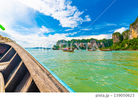 View from boat going to famous Railay beach in Krabi town, Thailand. Favorite place in Thailand with pure sea, white sand and beautiful limestone rocks. Vacation target in tropical paradise. View from boat going to famous Railay beach in Krabi town, Thailand. Favorite place in Thailand with pure sea, white sand and beautiful limestone rocks. Vacation target in tropical paradise. 139050623