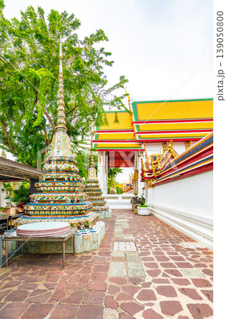 Wat Pho temple in Bangkok city, Thailand. View of pagoda and stupa in famous ancient temple. Religious buildings in buddhism style near Grand Palace. Oriental and Asian style, famous tourist target. 139050800
