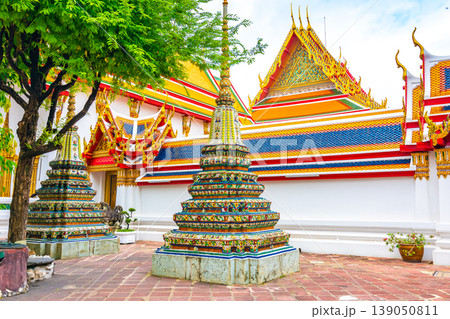 Wat Pho temple in Bangkok city, Thailand. View of pagoda and stupa in famous ancient temple. Religious buildings in buddhism style near Grand Palace. Oriental and Asian style, famous tourist target. 139050811