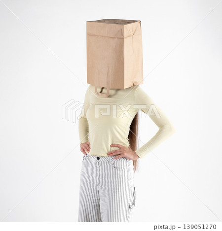 Person hiding identity with a paper bag on head Person hiding identity with a paper bag on head 139051270